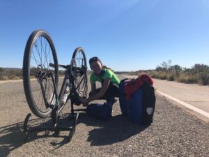 Elsa changing a bike flat tire