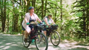 2 women riding bicycles on the trail