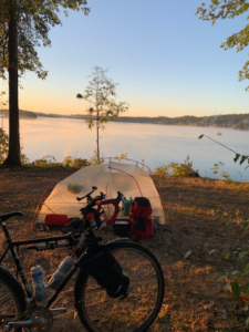 Bike and tent on the lakeshore