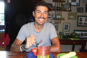 Man at dining table eating dinner