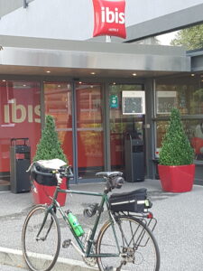 Bicycle parked in front of hotel entrance