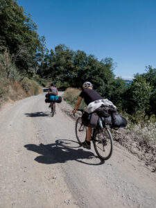 Bicycle riders on gravel road