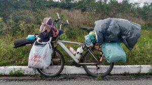 bicycle loaded for long distance touring parked on roadside