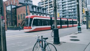 Urban street scene with train and bicycles