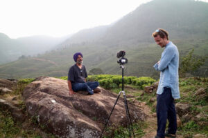 2 men filming a movie on a remote trail