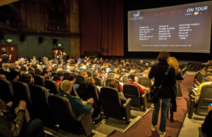 Inside image of a full movie theater