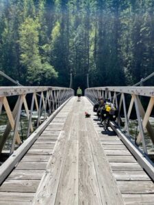 Bicyclist on a very long wooden bridge
