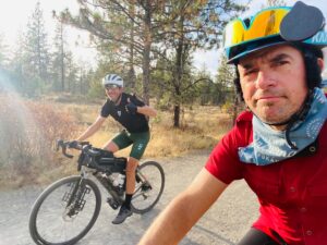 Two men riding bicycles, photo credit Justin M Short, BA