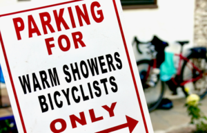 Street sign that says Parking for Warmshowers Bicyclists Only