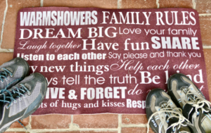 Door welcome mat that says Warmshowers Family Rules