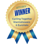 Blue ribbon with wording: Story Winner, Cycling Together Warmshowers & EuroVelo