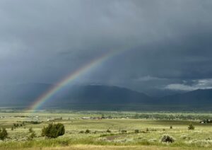 A rainbow against a storm darkened sky