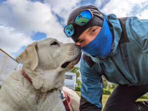 A man and his dog on a bicycling adventure