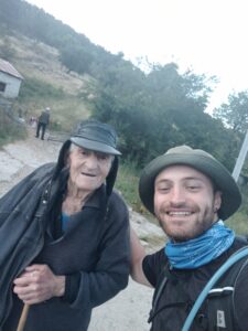 An older and younger man posing for a picture