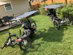 Two touring bicycles with solar panels mounted on top