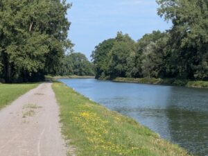 A bicycle path next to a river canal