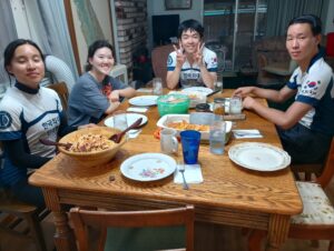 A group of people sitting around the dinner table.