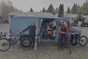 Couple with bikes in front of van