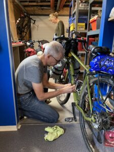 A man repairing his bicycle