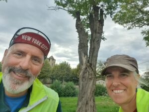 Man and woman posing with their bicycles