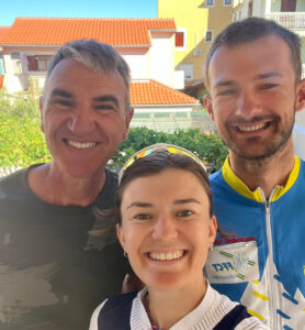 A group of 3 people posing for a picture