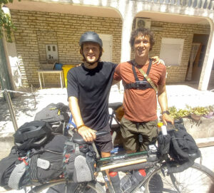 1 men with their fully loaded touring bicycles