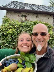 Man and woman with garden harvest