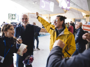 A man celebrating with fellow bicycle tourers