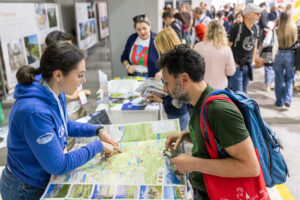 A person mapping out a route for a bicycle tourer